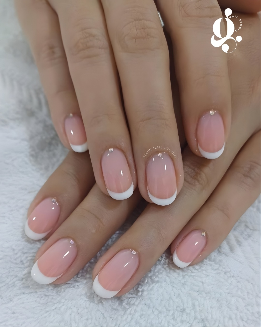 Pink and white French manicure created at Glow Nail Studio in Bergvliet